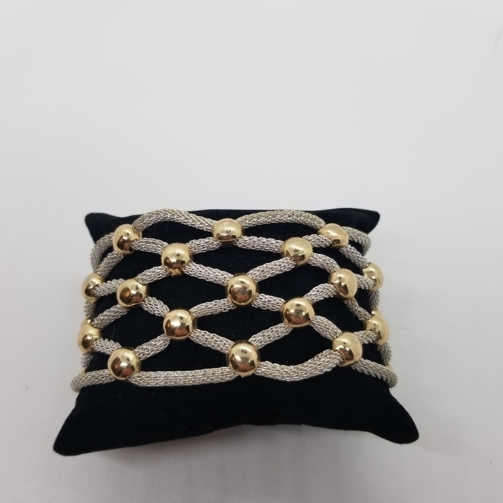 silver tone mesh tube woven bracelet with gold tone accents